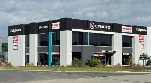 Commercial factory signage installation for AgMoto and CFMOTO showroom featuring large scale building signage designed for strong street visibility in Melbourne.